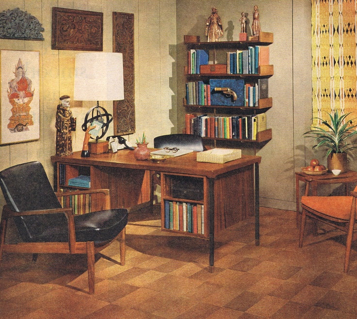 an office with bookshelves, desk and chairs in the middle of the room