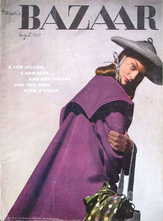 a magazine cover with a woman in a purple cape