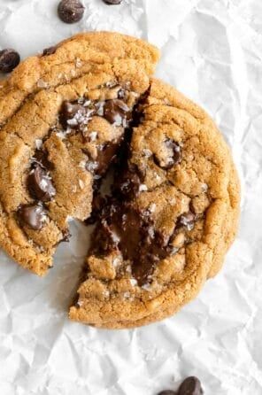 two chocolate chip cookies with one cut in half