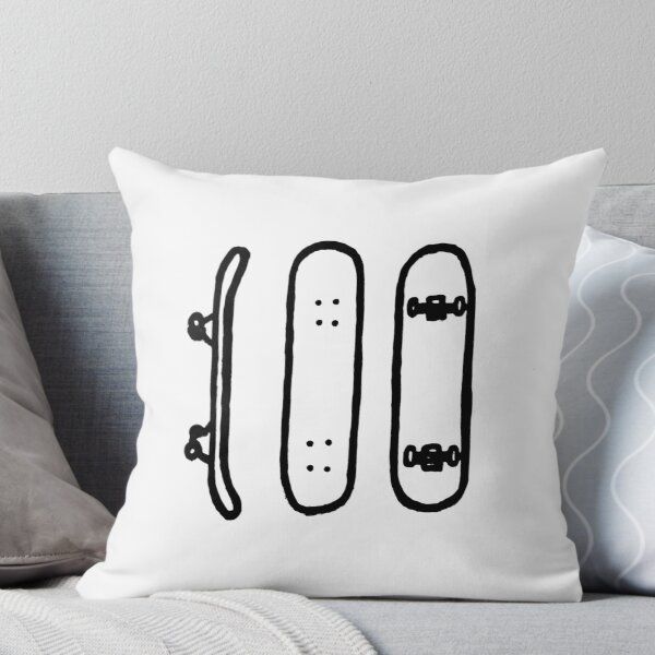 a white pillow with two skateboards drawn on it