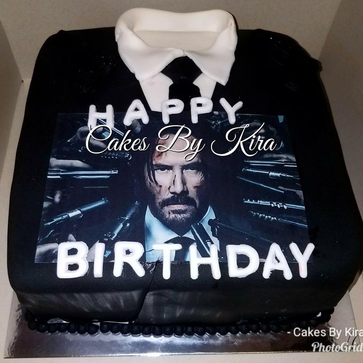 a birthday cake with the image of john wickley on it