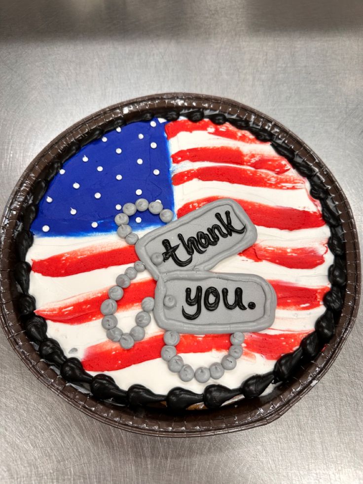 a cake decorated with an american flag and the words thank you