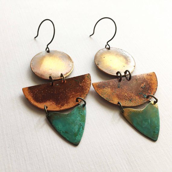 Inspired by the colors of Sedona, these earrings are made with oxidized metals using our verdigris green patina and our unique and original organic patina which creates orange and red on copper and brass.  Earrings are 3.5" long and hang from oxidized sterling silver ear wires.ssd jewelry © 2017Please not that the patina process is an organic process and shades of color will vary.  All of our items are HANDMADE and made to order and may take up to approx. 2 weeks to fabricate (not including ship Unique Hand Forged Green Earrings, Green Earrings With Oxidized Finish, Unique Green Earrings With Oxidized Finish, Artisan Orange Copper Earrings, Handmade Vintage Rust-colored Earrings, Handmade Vintage Rust Earrings, Unique Multicolor Patina Jewelry, Handmade Rust Vintage Earrings, Unique Multicolor Jewelry With Patina