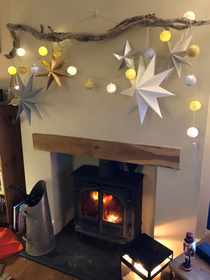 a living room with a fire place and decorations on the wall