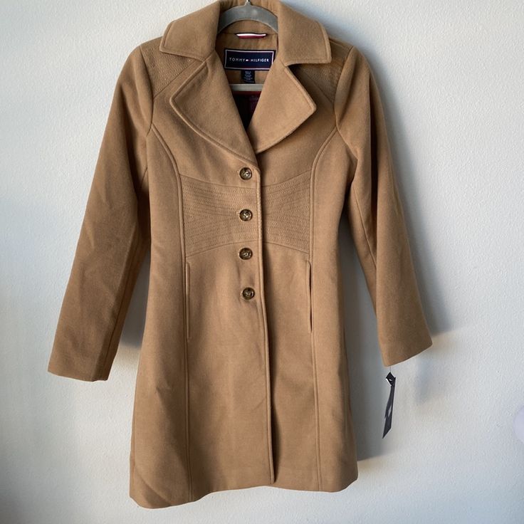 Please Make An Offer! This Is A Suede Like Material And The Perfect Warm Neutral Tan Color. It Is A Fitted Silhouette With Beautiful Detailing Along The Back, Shoulders And Waistline. It Is Brand New And Never Been Worn. It Comes With Am Extra Button On The Tag. It Is Lined. The Pocket Seams And Back Split Seam Are Still Intact. The Sleeve Measurement From Top Of The Shoulder To The End Of The Cuff Is Approximately 23 Inches. Tommy Hilfiger Winter Workwear Outerwear, Tommy Hilfiger Classic Long Sleeve Outerwear, Classic Tommy Hilfiger Long Sleeve Outerwear, Tommy Hilfiger Classic Winter Outerwear, Classic Tommy Hilfiger Winter Outerwear, Tommy Hilfiger Single Breasted Work Outerwear, Fitted Casual Tommy Hilfiger Outerwear, Tommy Hilfiger Fitted Casual Outerwear, Elegant Tommy Hilfiger Long Sleeve Outerwear