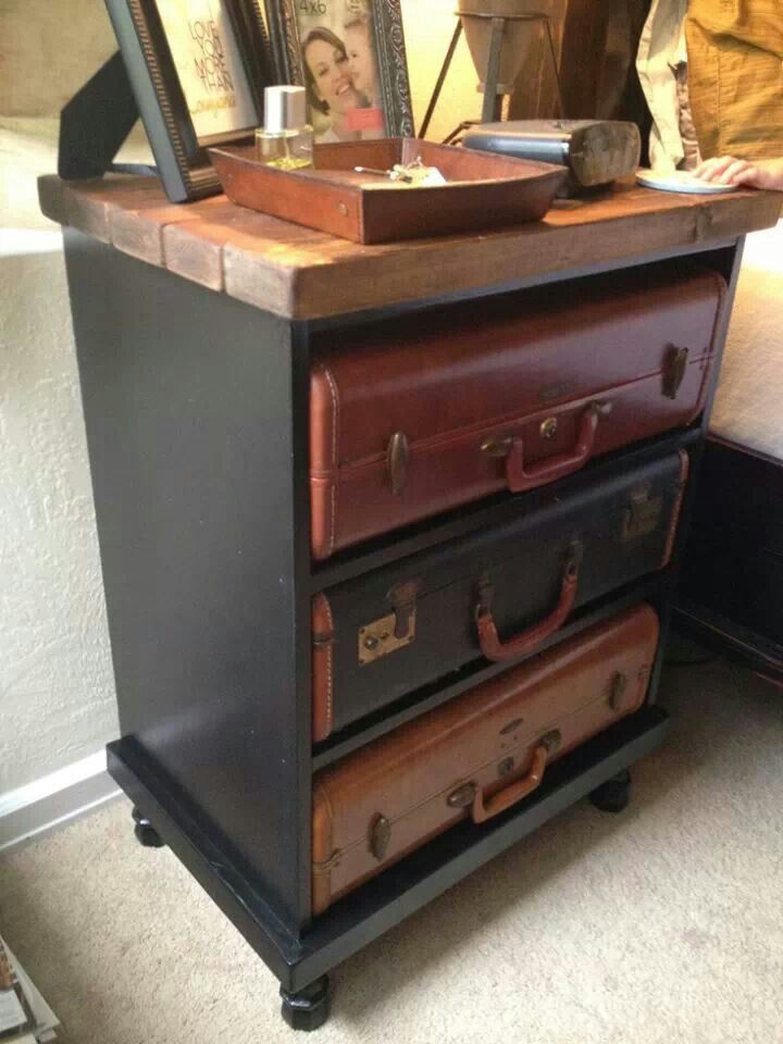 an old dresser is turned into a side table with suitcases on the top and bottom