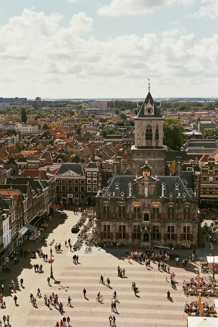 an aerial view of a city with people walking around