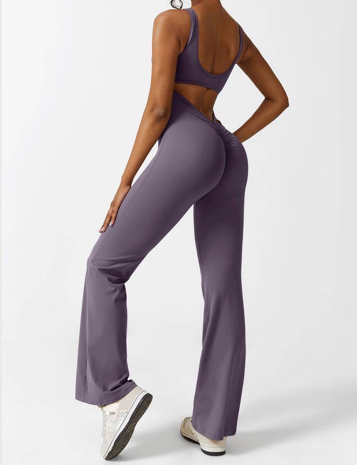 This jumpsuit is made of a durable and non-deforming fabric with a soft and moisture-wicking feel. It has a four-way stretch design that is comfortable and keeps you dry. The back has a stylish cutout that highlights the elegant butterfly bone structure. The deep V cut and scrunch at the hips enhance your silhouette. The flared shape elongates the legs and accentuates their curves. This jumpsuit is perfect for casual wear, sports, yoga, fitness, and various workouts.   Feature   Backless design Fitted Jumpsuits And Rompers With Back Opening, Fitted Jumpsuits With Back Opening, Stretch Elastane Backless Jumpsuits And Rompers, Fitted Solid Color Backless Jumpsuits And Rompers, Fitted Backless Jumpsuit In Solid Color, Stretch Solid Color Backless Jumpsuits And Rompers, Stretch Backless Solid Color Jumpsuit/romper, Stretch Backless Jumpsuits And Rompers Solid Color, Yoga Jumpsuit Outfit