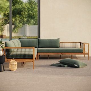 a living room filled with lots of furniture next to a large glass window on top of a building