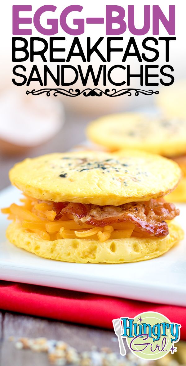 an egg and bacon breakfast sandwich on a white plate with text overlay that reads egg - bun breakfast sandwiches