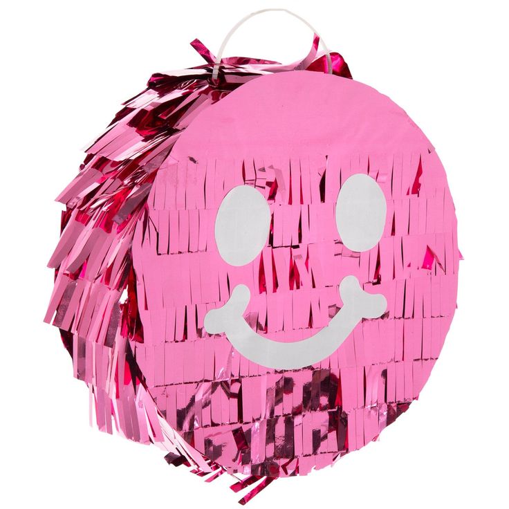 a pink pinata with a smiley face on it