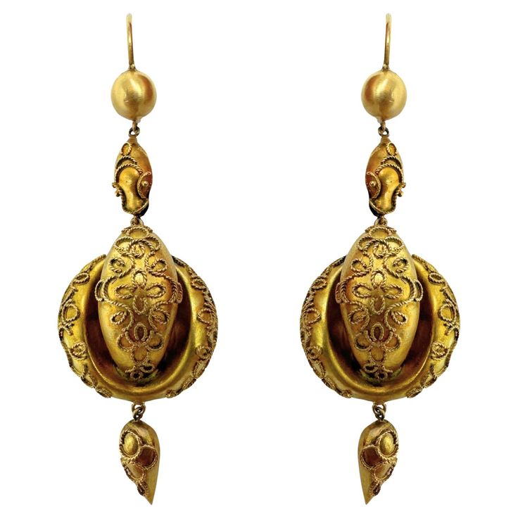 Elevate your look and embrace the elegance of the past with these 14k Victorian Drop Earrings. Made from 14k yellow gold, these earrings feature intricate details and a length of 2 inches for a refined touch. In good condition, they offer a timeless and lightweight option at 7.1 grams. 14k Victorian Drop Earrings Condition: In good condition with some minor surface wear consistent with age. Period: Victorian Length: 2 inches Metal: 14k Yellow Gold Weight: 7.1 grams Antique Yellow Gold Drop Earrings, Victorian Yellow Gold Drop Earrings, Victorian Gold Earrings For Formal Occasions, Victorian Style Hallmarked Earrings For Formal Occasions, Formal Victorian Hallmarked Earrings, Formal Victorian Gold Earrings, Antique 14k Gold Hallmarked Earrings, Antique Yellow Gold Ceremonial Earrings, Vintage Yellow Gold Earrings With Intricate Design