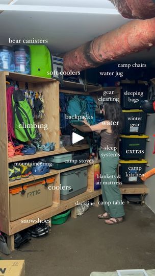 a person standing in front of a shelf filled with items