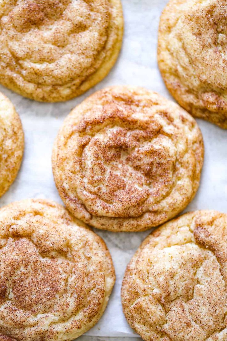 freshly baked cinnamon sugar cookies on a baking sheet