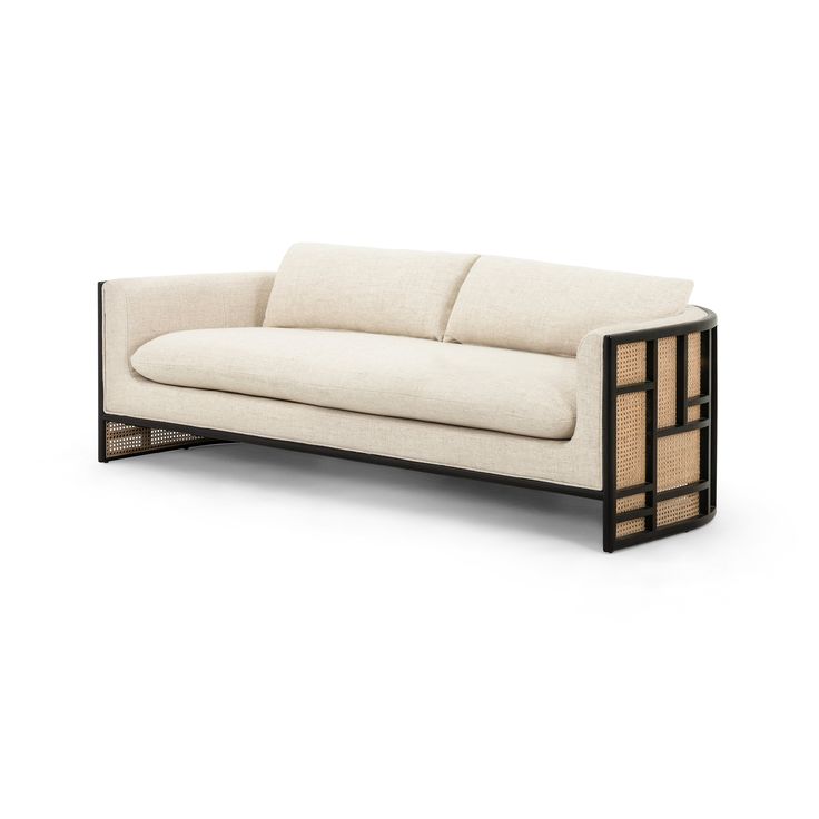 a white couch sitting on top of a wooden frame