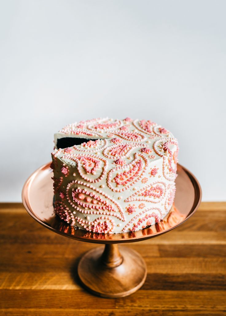 a cake sitting on top of a wooden table