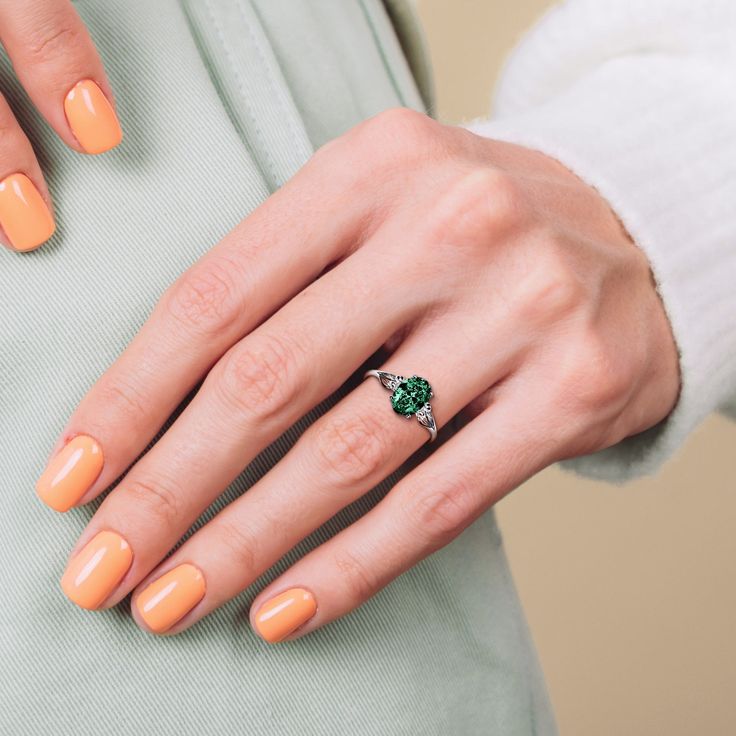 The May Emerald Birthstone Ring is a splendid celebration of those born in the lush springtime of May, created with S925 Sterling Silver for lasting grace. The ring showcases an emerald-colored centerpiece, treasured for its rich green hue that signifies rebirth and love. Designed to epitomize versatility and timeless elegance, this ring is the perfect homage to motherhood, serving as an ideal gift for Mother’s Day or a significant token for a mother with a May birthday. High-Quality Craftsmanship: Our dedication to excellence shines through in the meticulous crafting of this ring. Utilizing high-grade S925 Sterling Silver, we ensure that each piece retains its luster over time, standing up to daily wear while resisting tarnishing. The precision in the cut and polish of the sterling silver May Birthstone Ring In Tsavorite, Tsavorite Birthstone Ring For May Birthstone Gift, Classic Green Birthstone Ring With Accent Stones, Promise Sterling Silver Emerald Ring For May Birthstone, Sterling Silver Emerald Promise Ring For May Birthstone, Elegant Emerald Ring For Promise - May Birthstone, Sterling Silver Emerald Promise Ring, Elegant Emerald Promise Ring For May Birthstone, Classic Green Jewelry For Promise Occasions