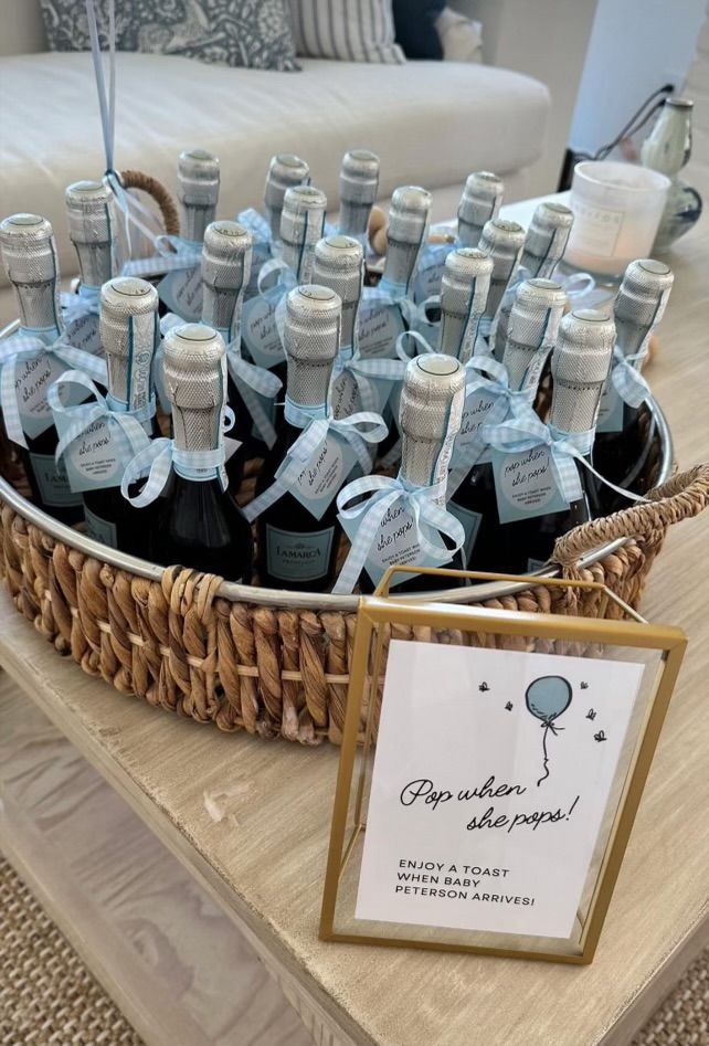 a basket filled with bottles of wine on top of a table