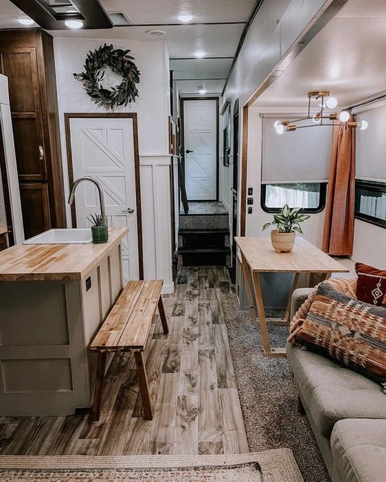 a living room and kitchen in a trailer