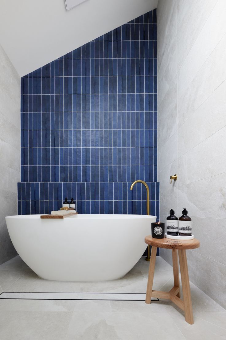 Indigo blue feature wall in bathroom Blue Tile Feature Wall Bathroom, Vertical Blue Subway Tile Bathroom, Blue Vertical Tile Bathroom, Blue Subway Tile Bathroom, Ensuite Tiles, Blue Subway Tile, Blue Bathroom Tile, Subway Tiles Bathroom, Master Ensuite