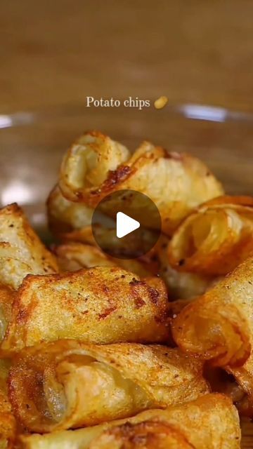 some fried food is on a plate with a wooden table