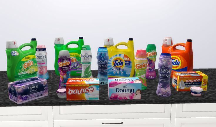 several different types of cleaning products are lined up on a countertop in front of white cabinets