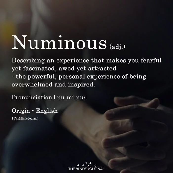 a person holding their hands together with the words numinous in front of them