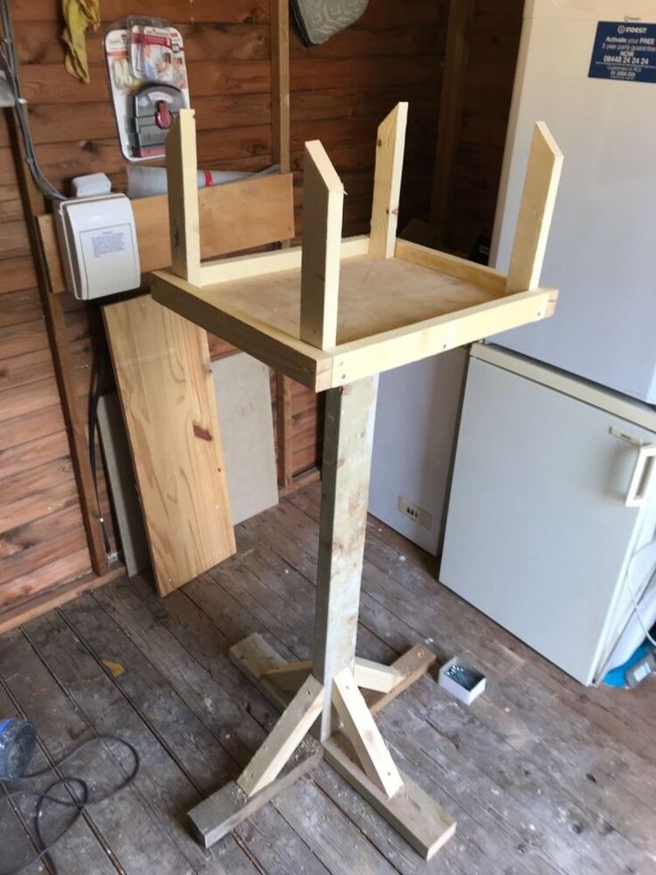 a wooden chair sitting on top of a wooden floor