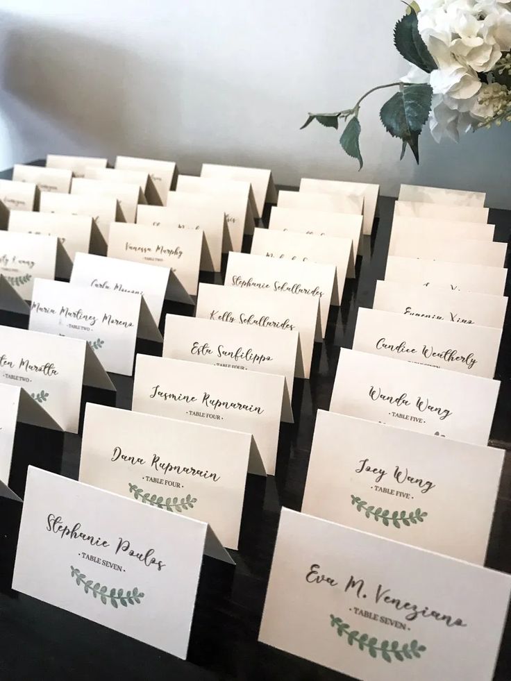 many place cards are placed on a table