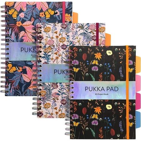 three notebooks with floral designs and the words pukka pad written on each page