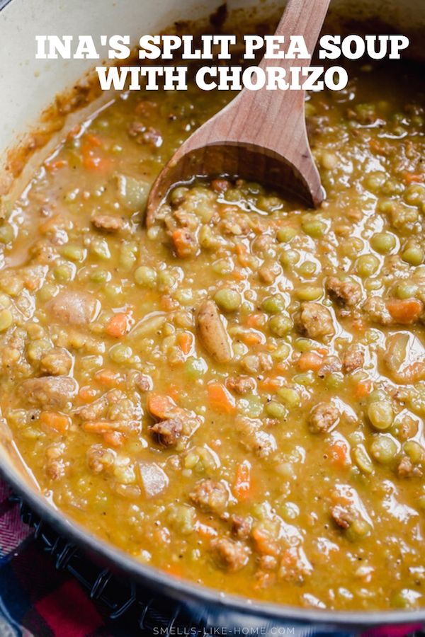 a pot filled with beans and meat next to a wooden spoon in the bowl that says ina's split pea soup with chorizo