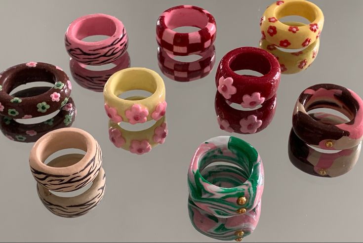 several different types of rings with flowers on them