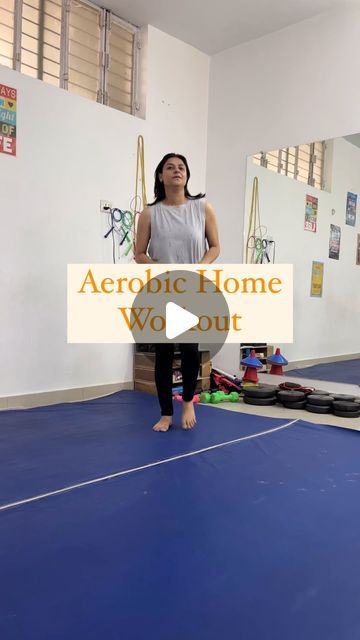 a woman standing on top of a blue floor