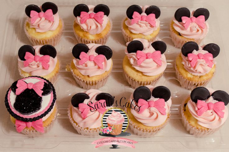 cupcakes decorated with pink and black minnie mouse ears