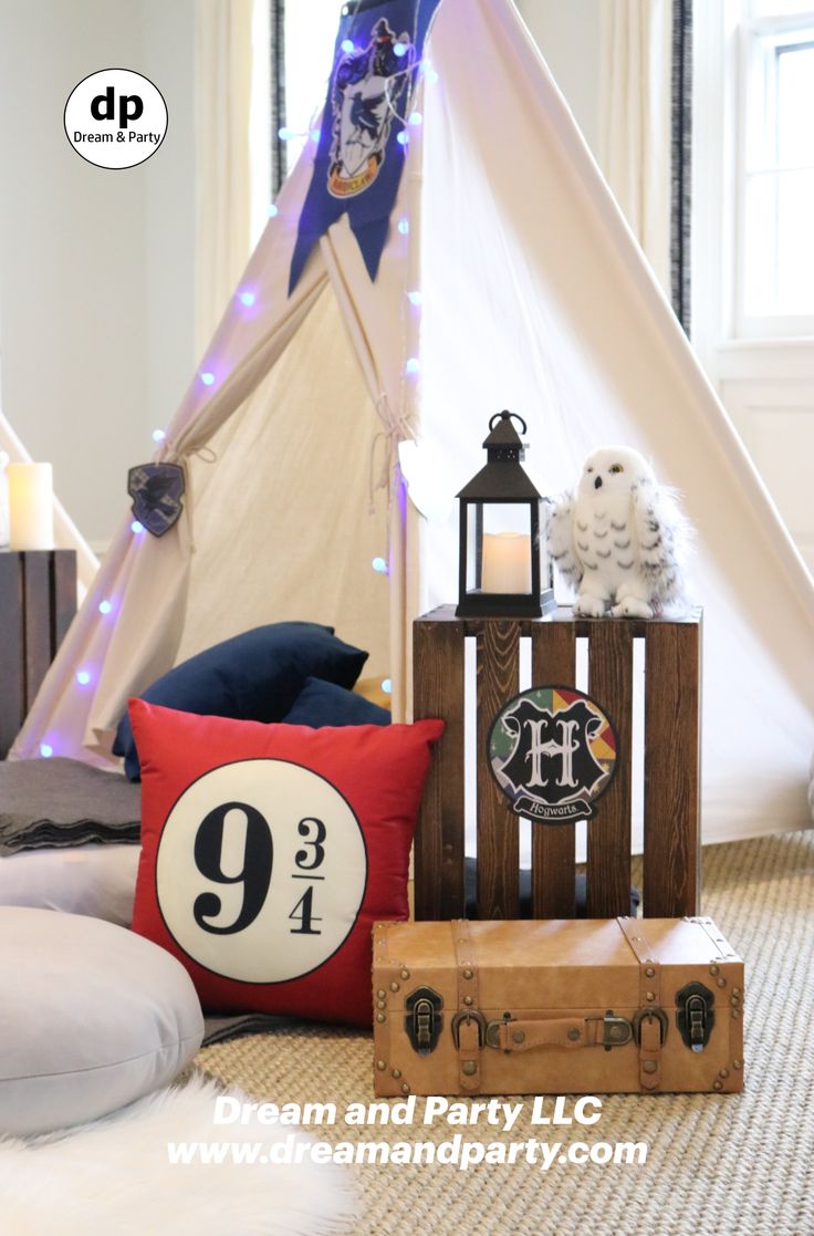 there is a teepee tent and pillows on the floor