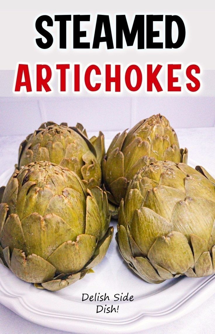 three artichokes on a white plate with the words steamed artichokes