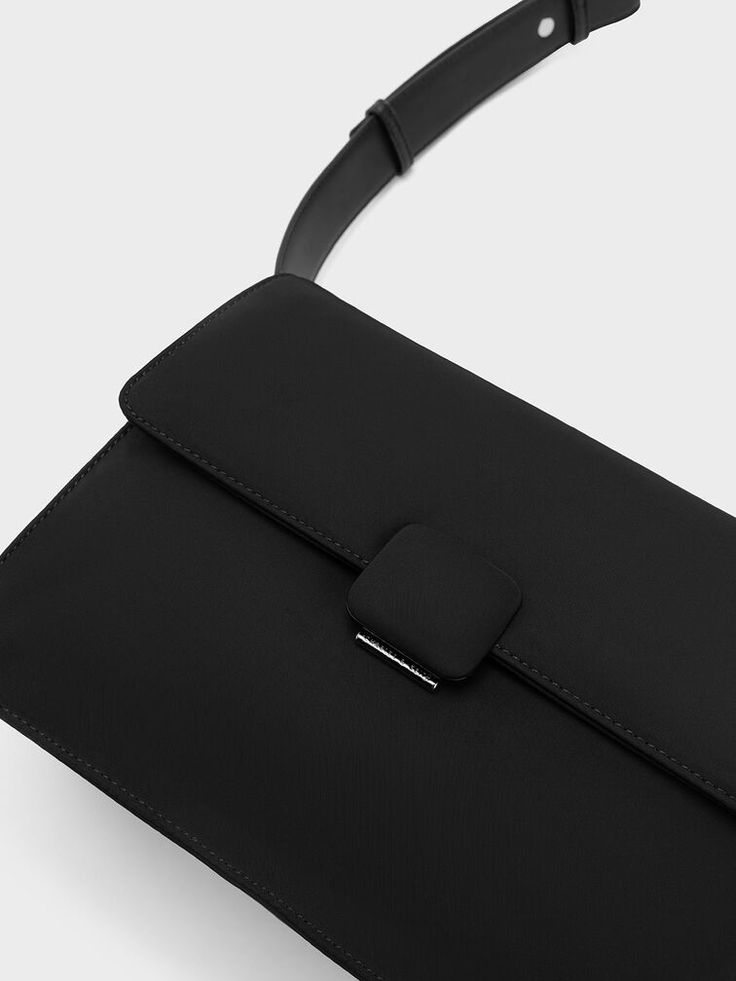 A practical, not-so-little black bag is a universal staple in every wardrobe, and this sleek iteration of the Koa crossbody embodies that. Its minimal, unembellished exterior and inky black finish lets the clean lines stand out for a contemporary take on the classic messenger-style bag. With a push-lock closure that opens up to a roomy interior, it will fit everything you need for the day. Sling it across the body with the thick adjustable strap, or wear it as a casual shoulder bag. Nylon Crossbody Bag, Size Chart For Kids, Charles Keith, Womens Crossbody Bag, Black Cross Body Bag, Black Bag, Belt Bag, Comfortable Shoes, Crossbody Bags