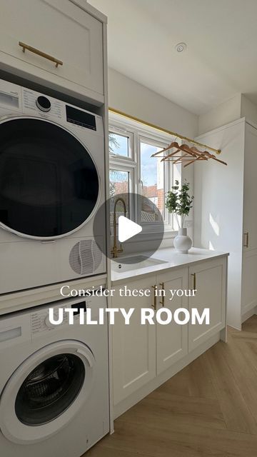 an image of a laundry room with washer and dryer on the counter top