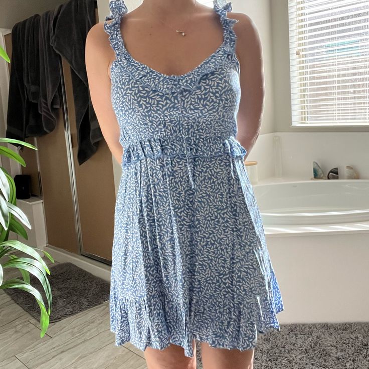 Blue And White Summer Dress Size Medium Brand New Still With Tags On From Keyway And Punch Light Blue Mini Sundress, Light Blue Mini Sundress Casual Style, Light Blue Casual Mini Sundress, Casual Light Blue Mini Sundress, Blue Mini Sundress With Ruffles, Blue Ruffled Mini Sundress, Blue Floral Print Mini Dress For Day Out, Blue Mini Sundress For Spring, Light Blue Floral Print Sundress For Day Out