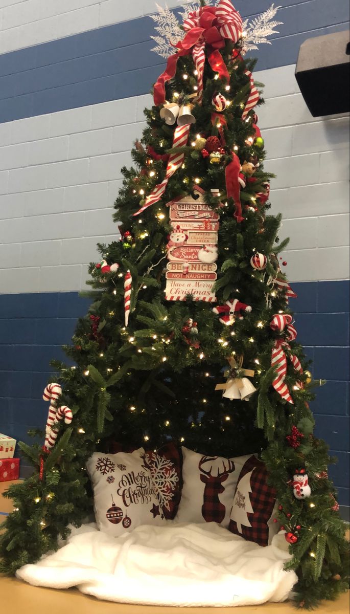 a christmas tree decorated with candy canes and ornaments