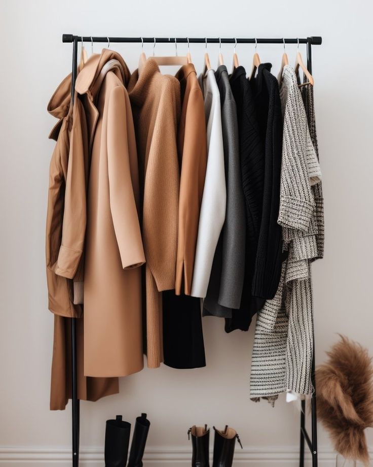 a rack with coats and boots hanging on it