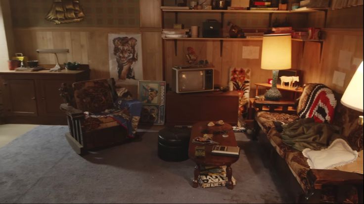 a living room filled with furniture and lots of clutter