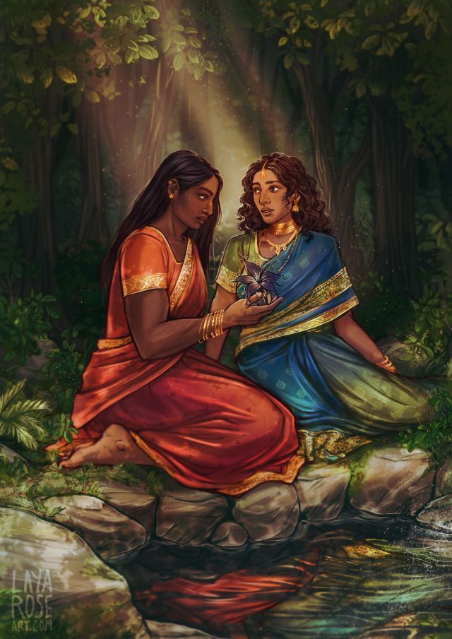 two women sitting next to each other in the woods