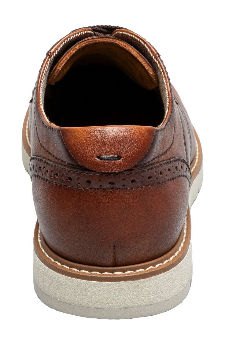 A wingtip toe and refined broguing add timeless style to this leather derby set on a cushioned sole for desk-to-dinner comfort. Cushioned insole Leather upper/textile lining/rubber sole Imported Cognac Wingtip Shoes For Business Casual, Cognac Wingtip Oxfords For Semi-formal Occasions, Classic Brown Wingtip Derby Shoes, Cognac Wingtip Oxfords With Leather Lining, Cognac Wingtip Oxfords For Business Casual, Classic Cushioned Oxfords For Semi-formal Occasions, Semi-formal Cognac Oxfords With Brogue Detailing, Classic Oxfords With Cushioned Footbed For Semi-formal Occasions, Classic Semi-formal Oxfords With Cushioned Footbed