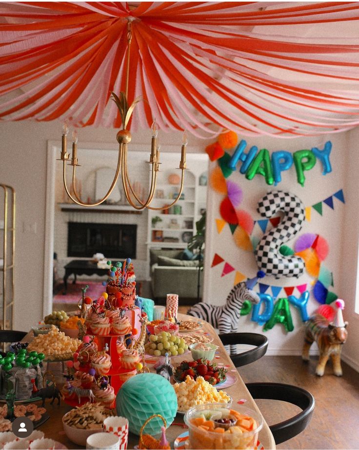 a table filled with lots of food and decorations