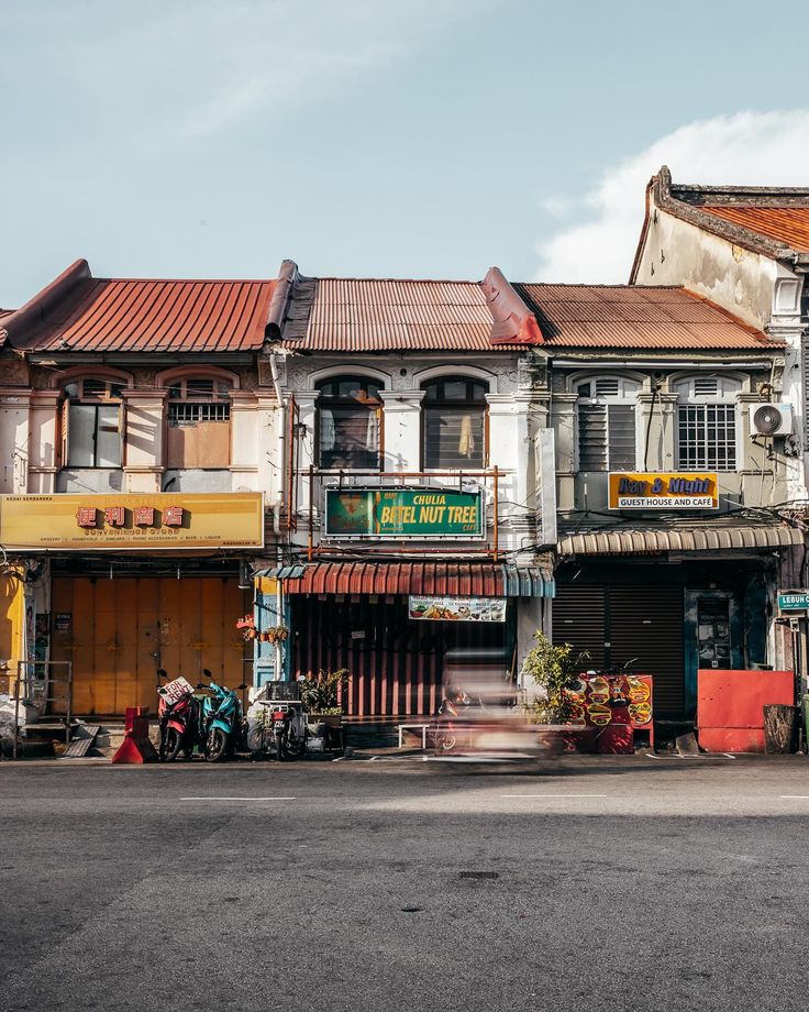 an old building in the middle of a street