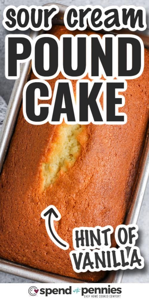 a loaf of sour cream pound cake in a pan with the words hint of vanilla on it