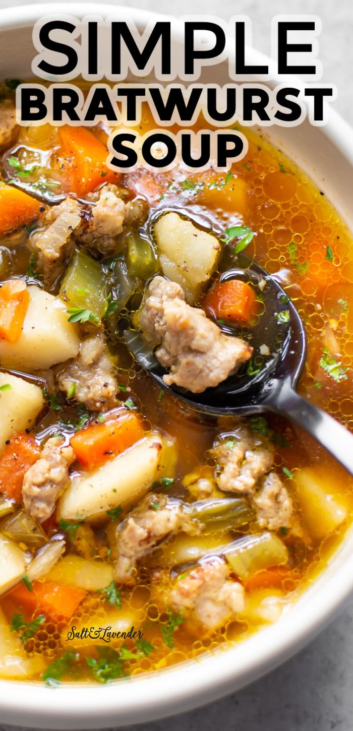 a close up of a bowl of soup with meat and veggies in it