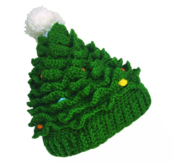 a green knitted christmas tree hat with white pom - pom