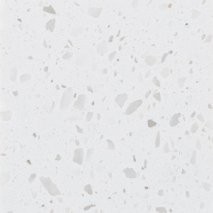 a white marble floor with small pieces of glass on it